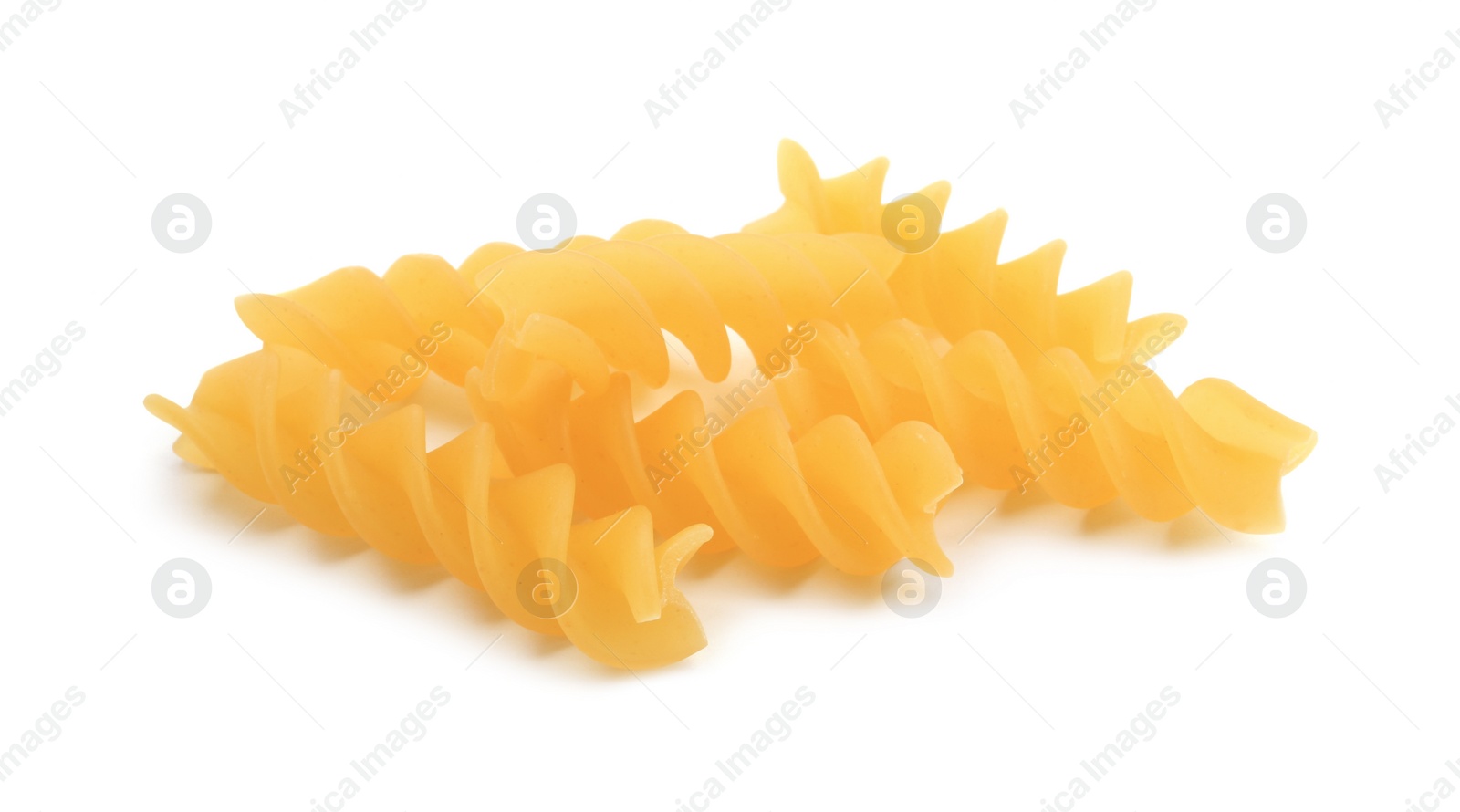 Photo of Raw fusilli pasta isolated on white. Italian cuisine