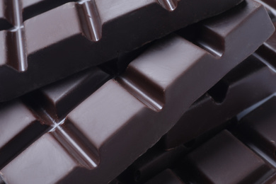 Photo of Delicious dark chocolate as background, closeup view