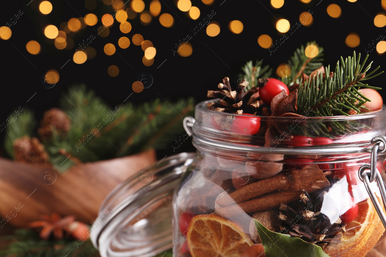 Photo of Aroma potpourri with different spices in jar, closeup view. Space for text