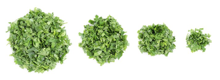 Image of Set with heaps of cut parsley isolated on white, top view