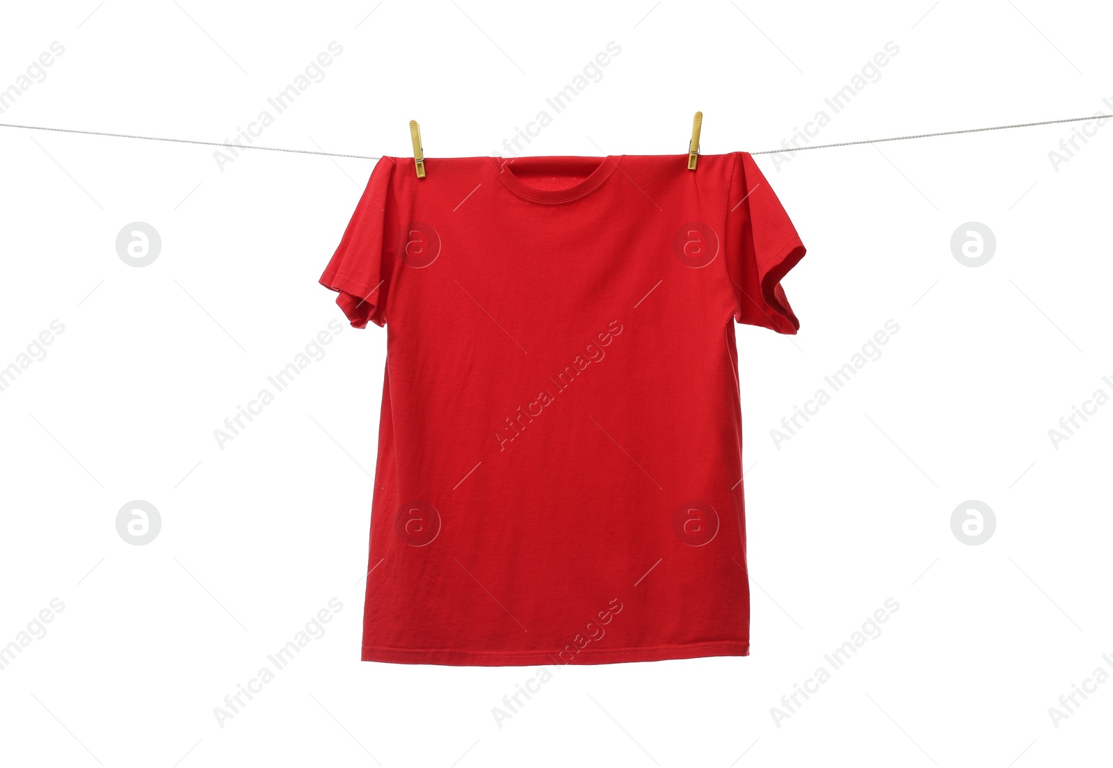 Photo of One red t-shirt drying on washing line isolated on white