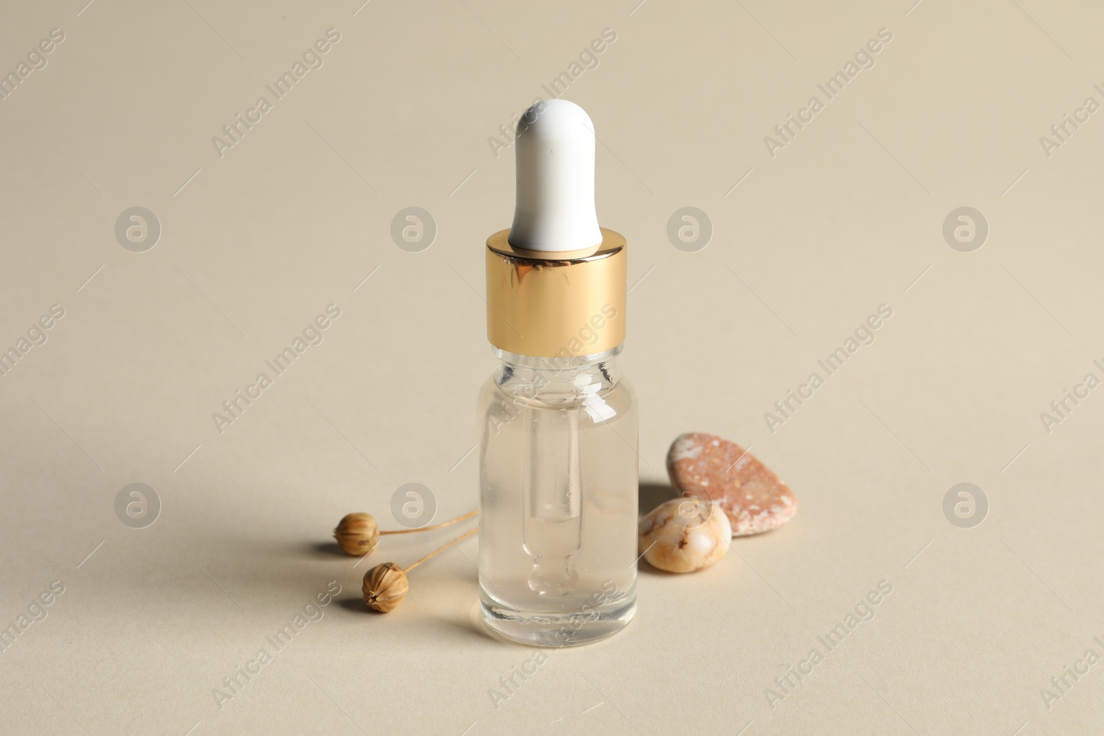 Photo of Composition with bottle of cosmetic serum on beige background