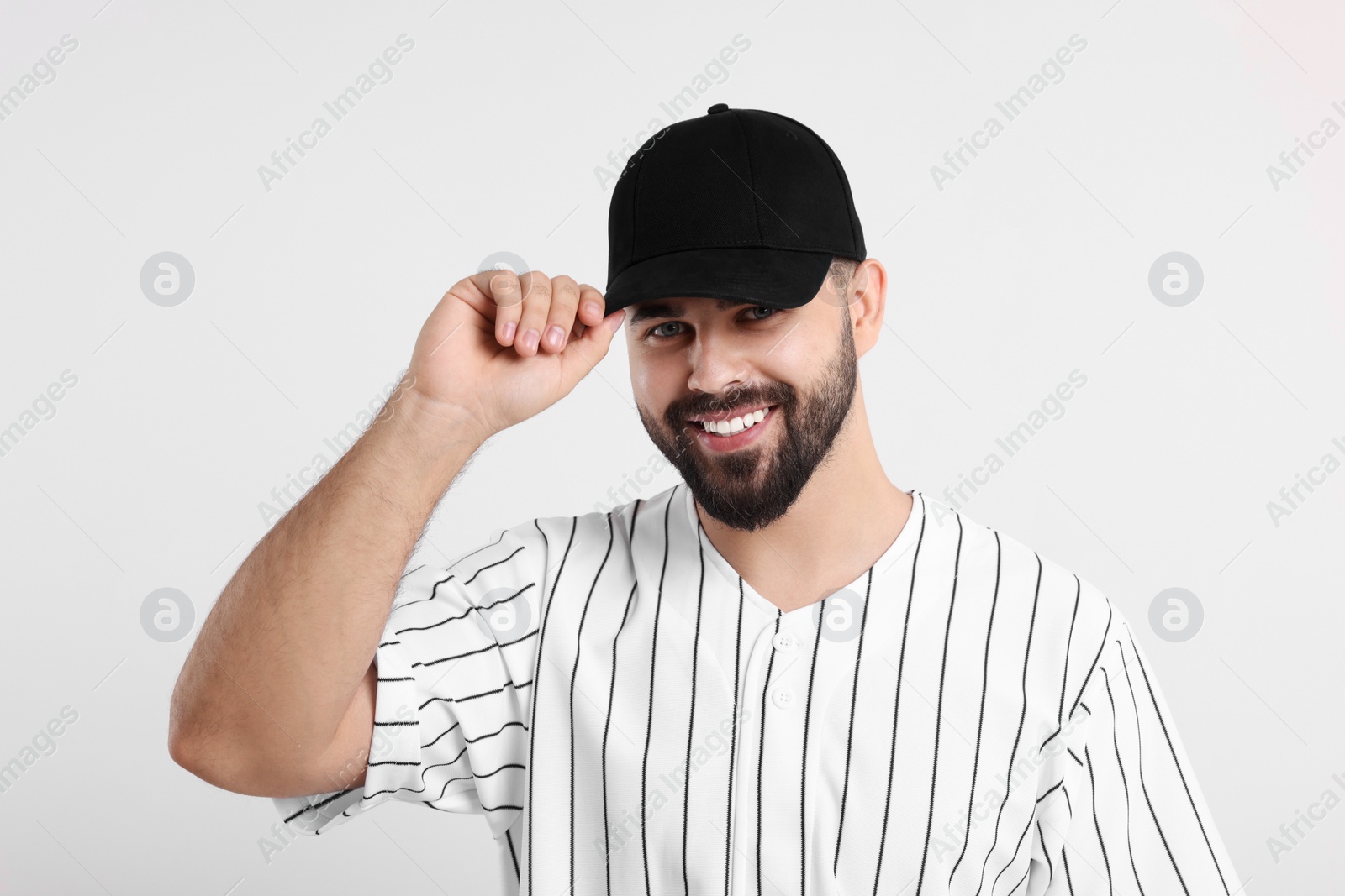 Photo of Man in stylish black baseball cap on white background