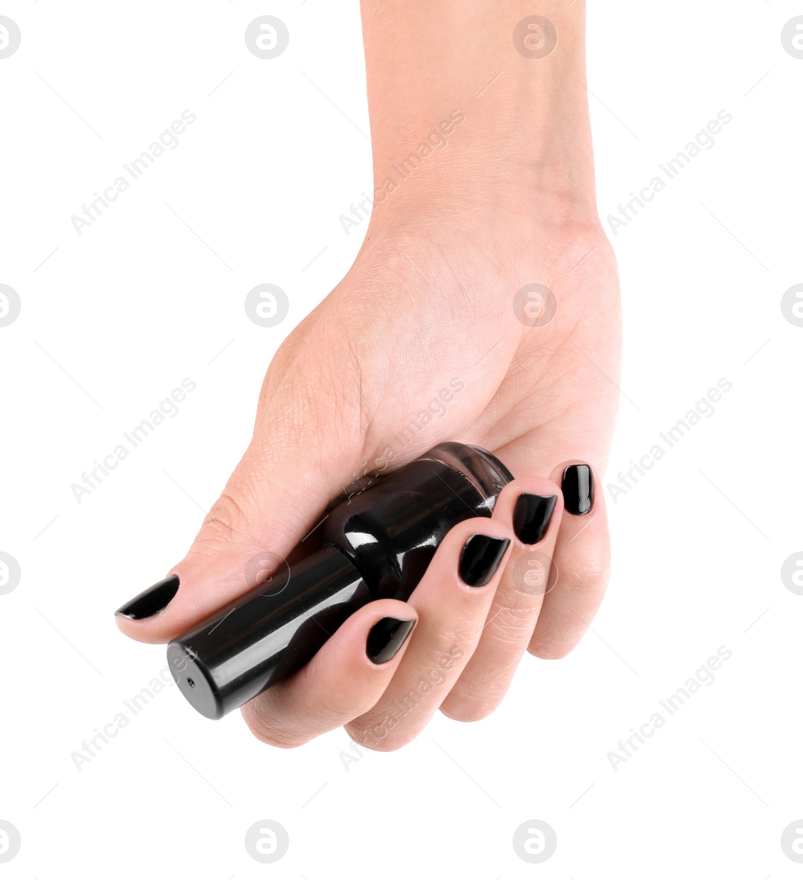 Photo of Woman with black manicure holding nail polish bottle on white background, closeup