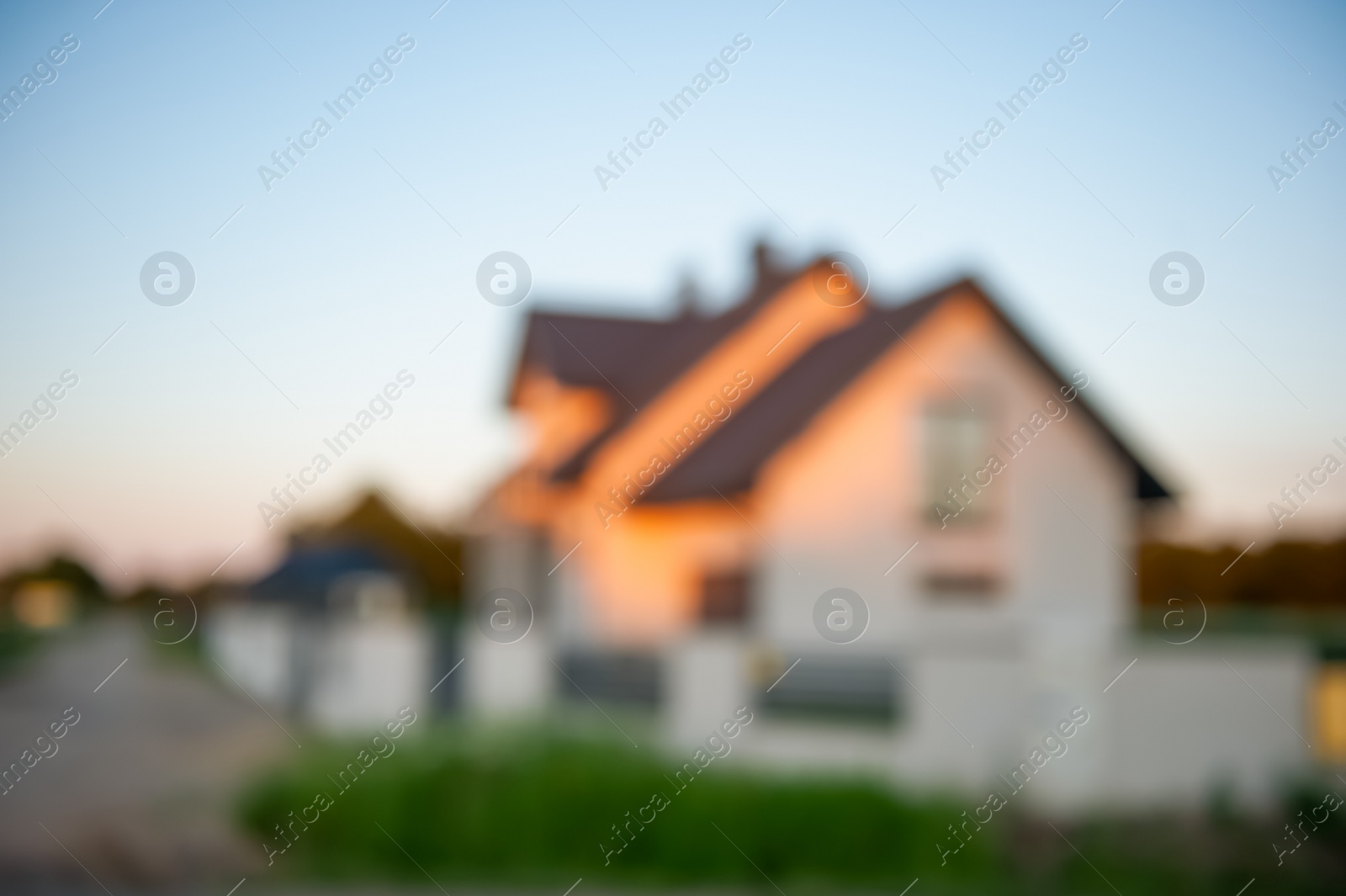 Photo of Blurred view of beautiful house in evening