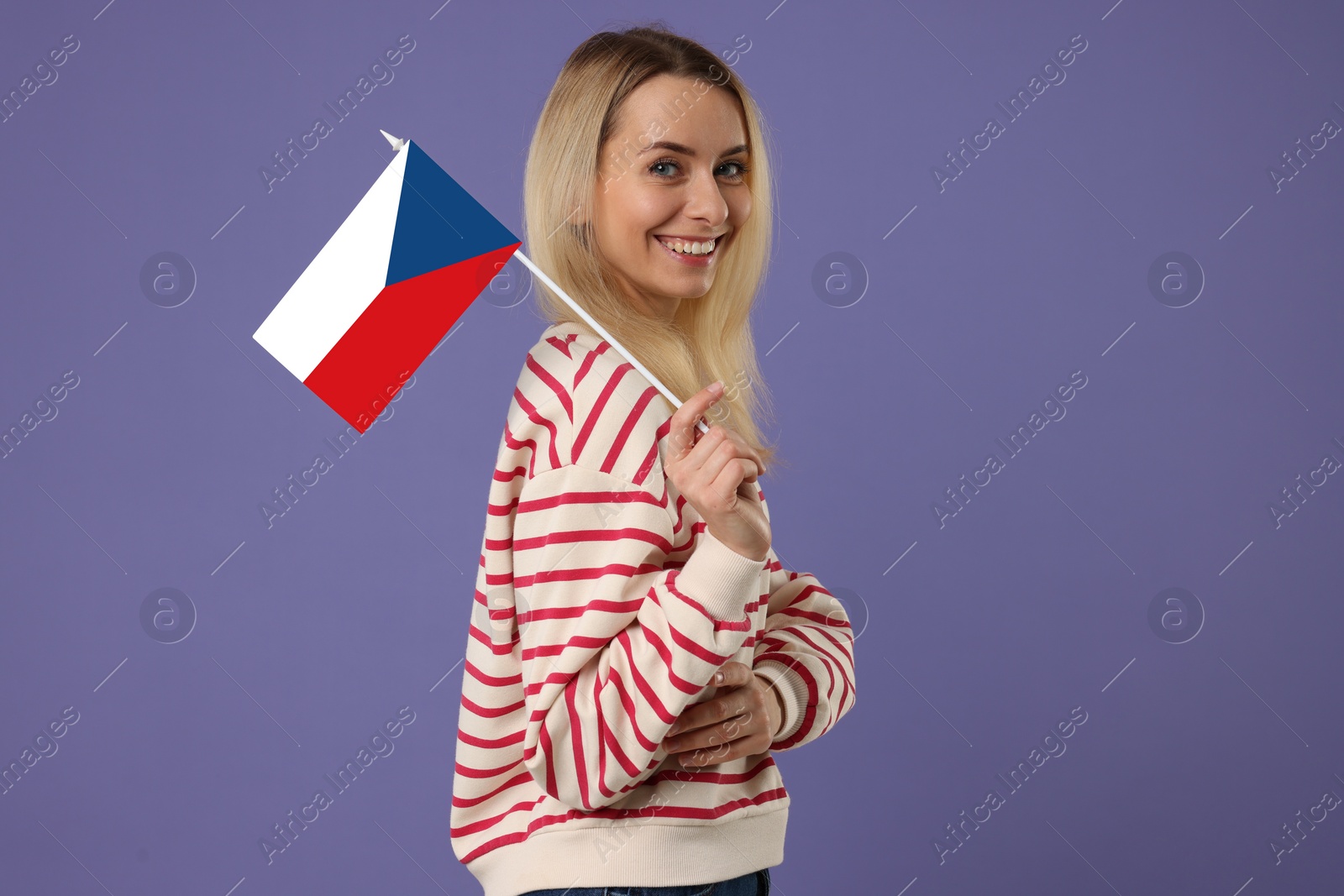 Image of Happy young woman with flag of Czech republic on purple background