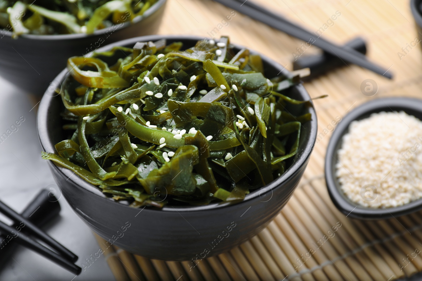 Photo of Fresh laminaria (kelp) seaweed served on table, closeup