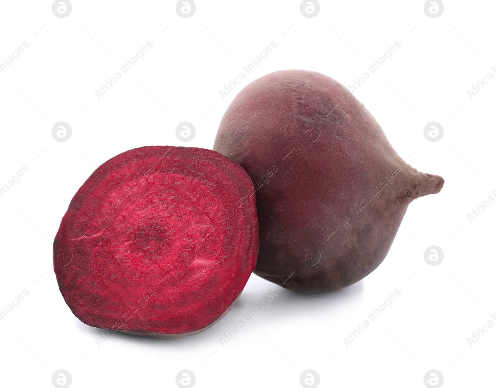 Photo of Cut and whole beets on white background. Taproot vegetable