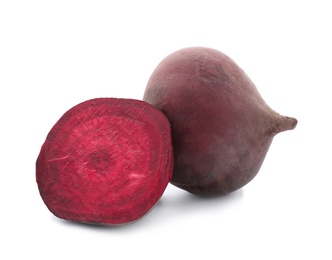 Photo of Cut and whole beets on white background. Taproot vegetable