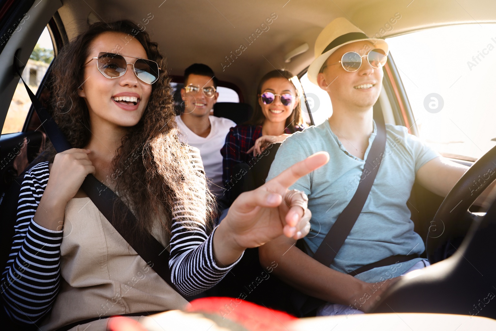 Photo of Happy friends together in car on road trip