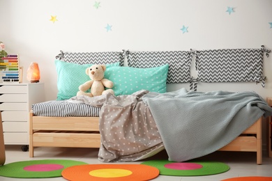 Photo of Modern child room interior with comfortable bed