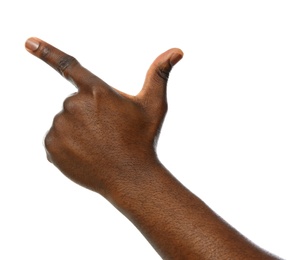 African-American man pointing at something on white background, closeup