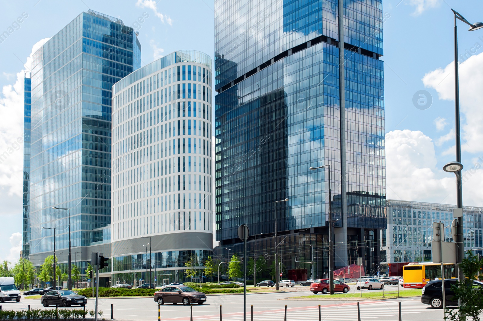 Photo of Road, lawn, vehicle and beautiful buildings in city