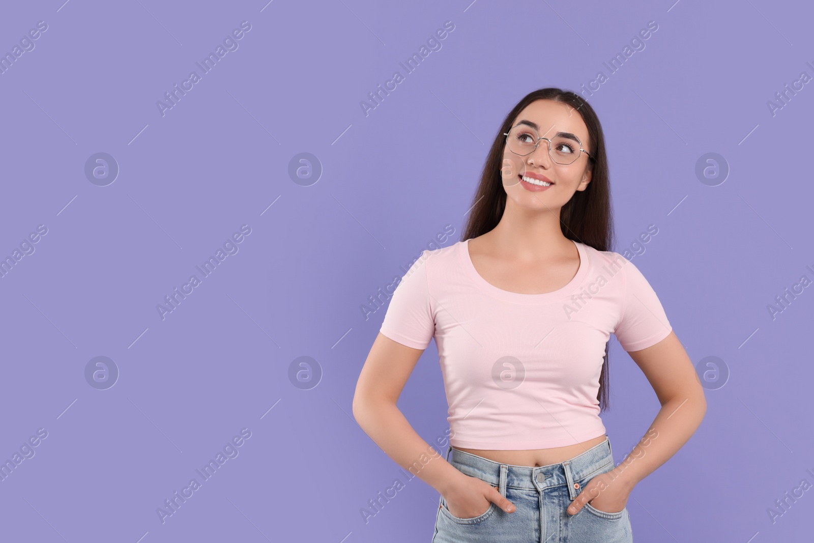 Photo of Beautiful woman wearing glasses on violet background, space for text