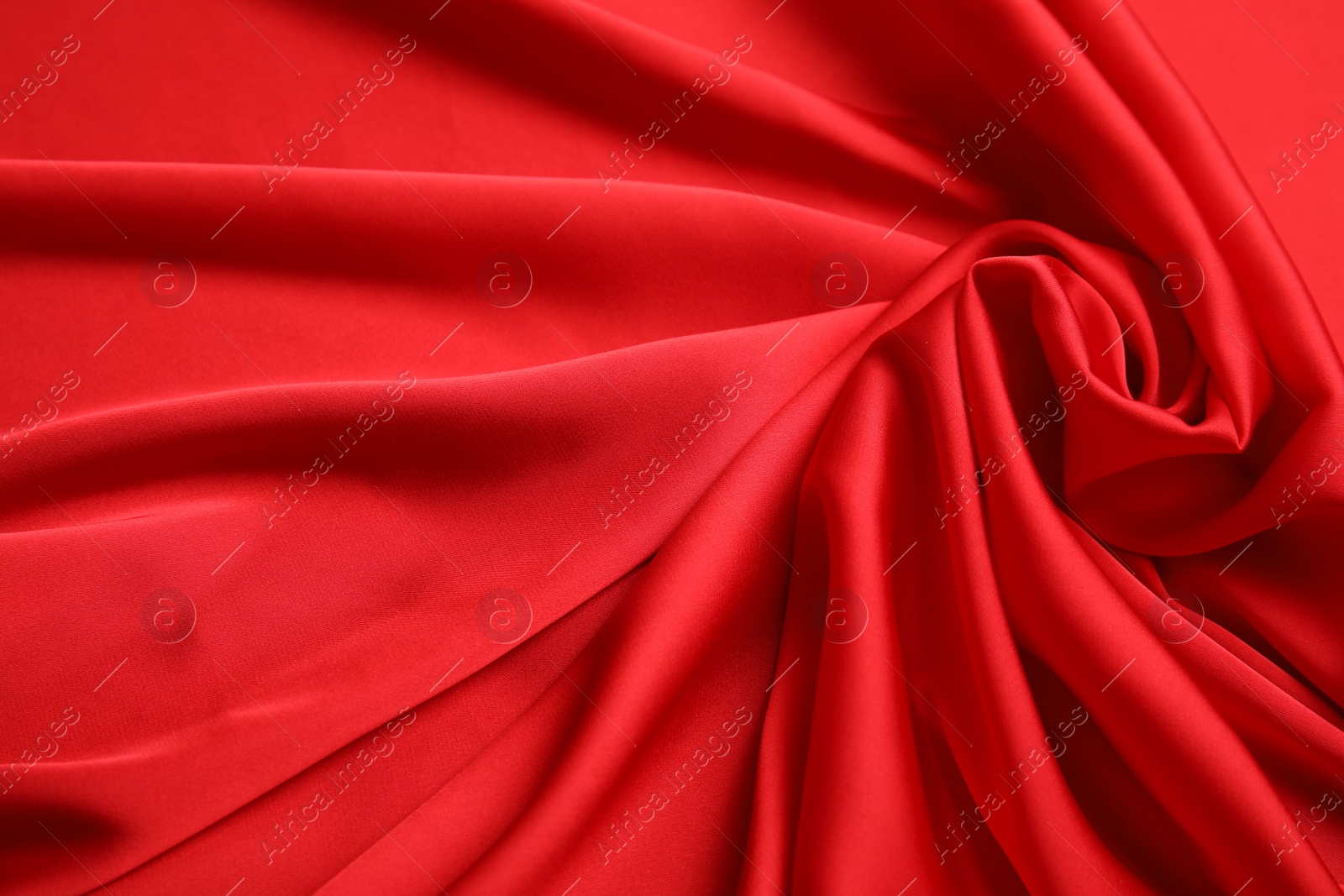 Photo of Texture of delicate red silk as background, top view