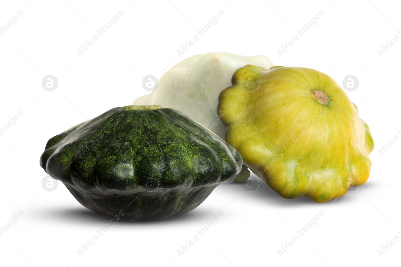 Image of Three fresh different pattypan squashes on white background