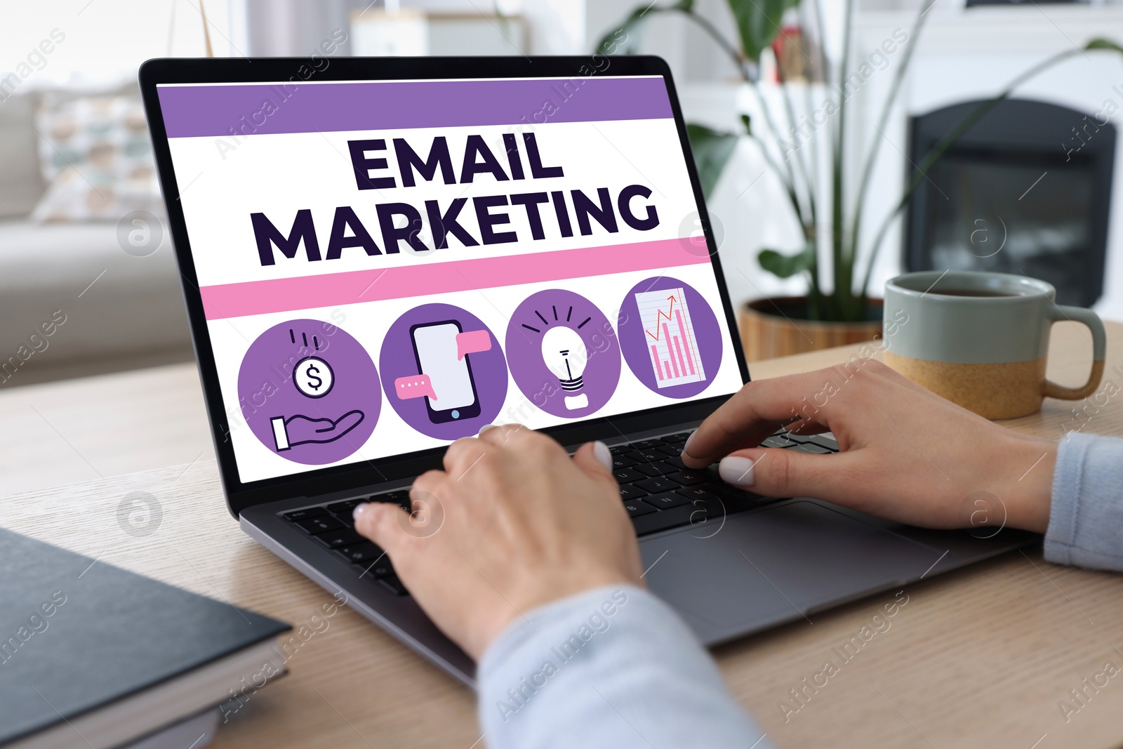 Image of Email marketing. Woman using laptop at table, closeup