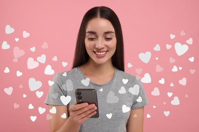 Long distance love. Woman chatting with sweetheart via smartphone on pink background. Hearts flying out of device and swirling around her