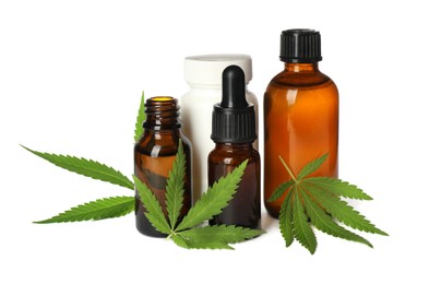 Photo of CBD oil, THC tincture, pill bottle and hemp leaves on white background