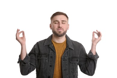 Young man meditating on white background. Personality concept