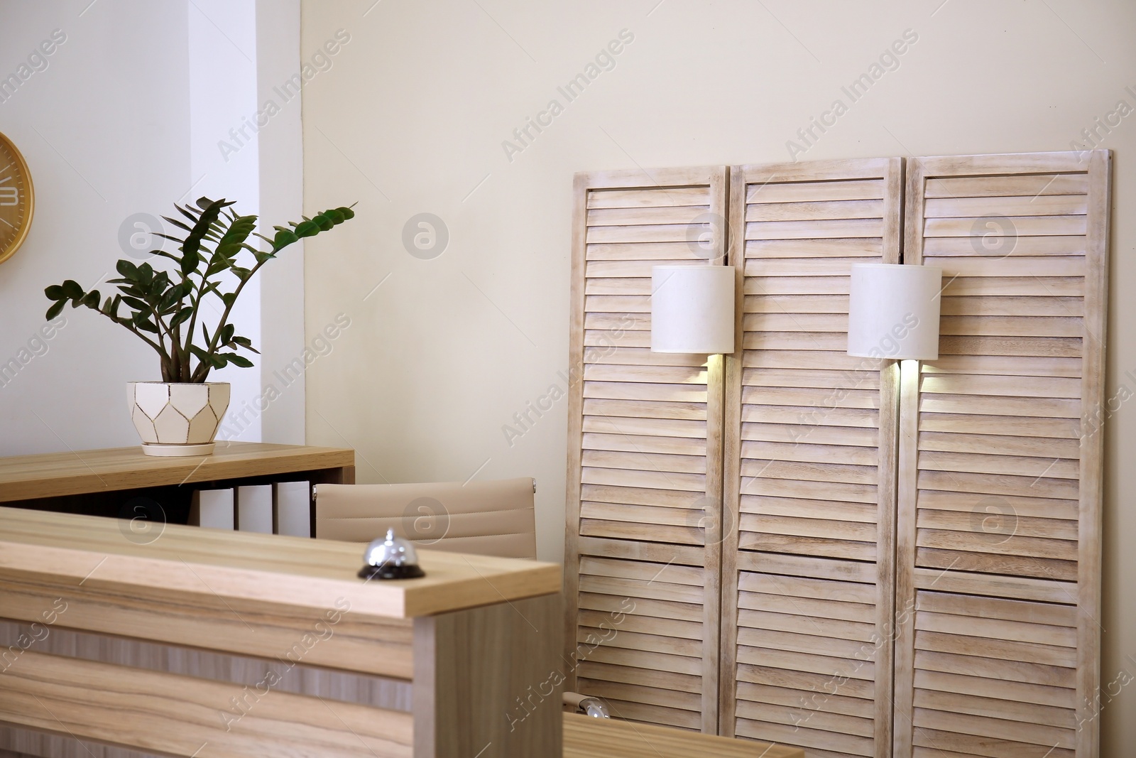 Photo of Receptionist desk in hotel. Workplace interior