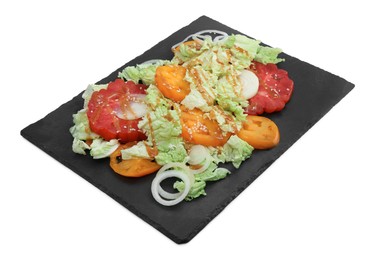 Photo of Slate plate of delicious salad with Chinese cabbage, tomatoes and onion on white background