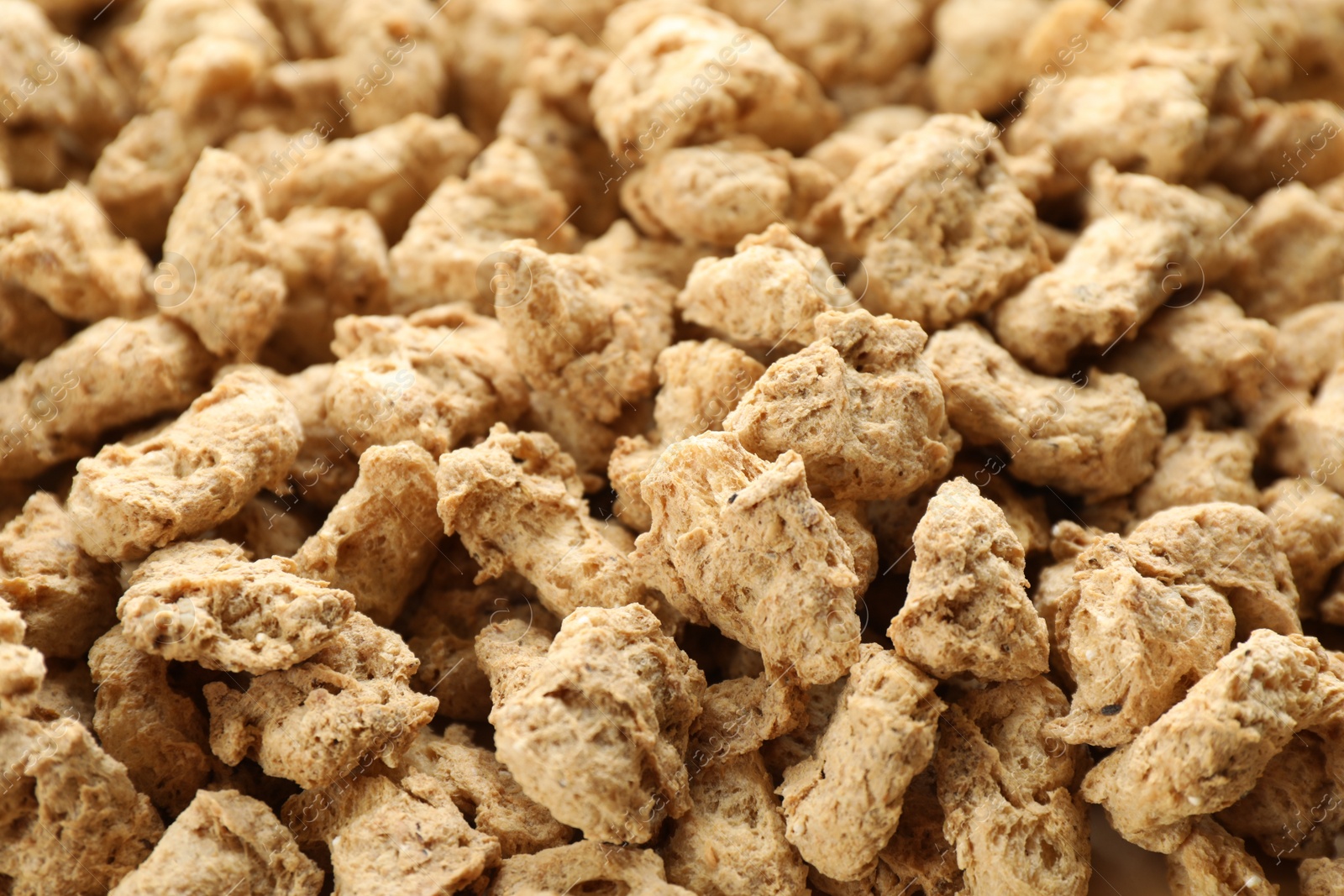 Photo of Dehydrated soy meat chunks as background, closeup