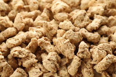 Photo of Dehydrated soy meat chunks as background, closeup