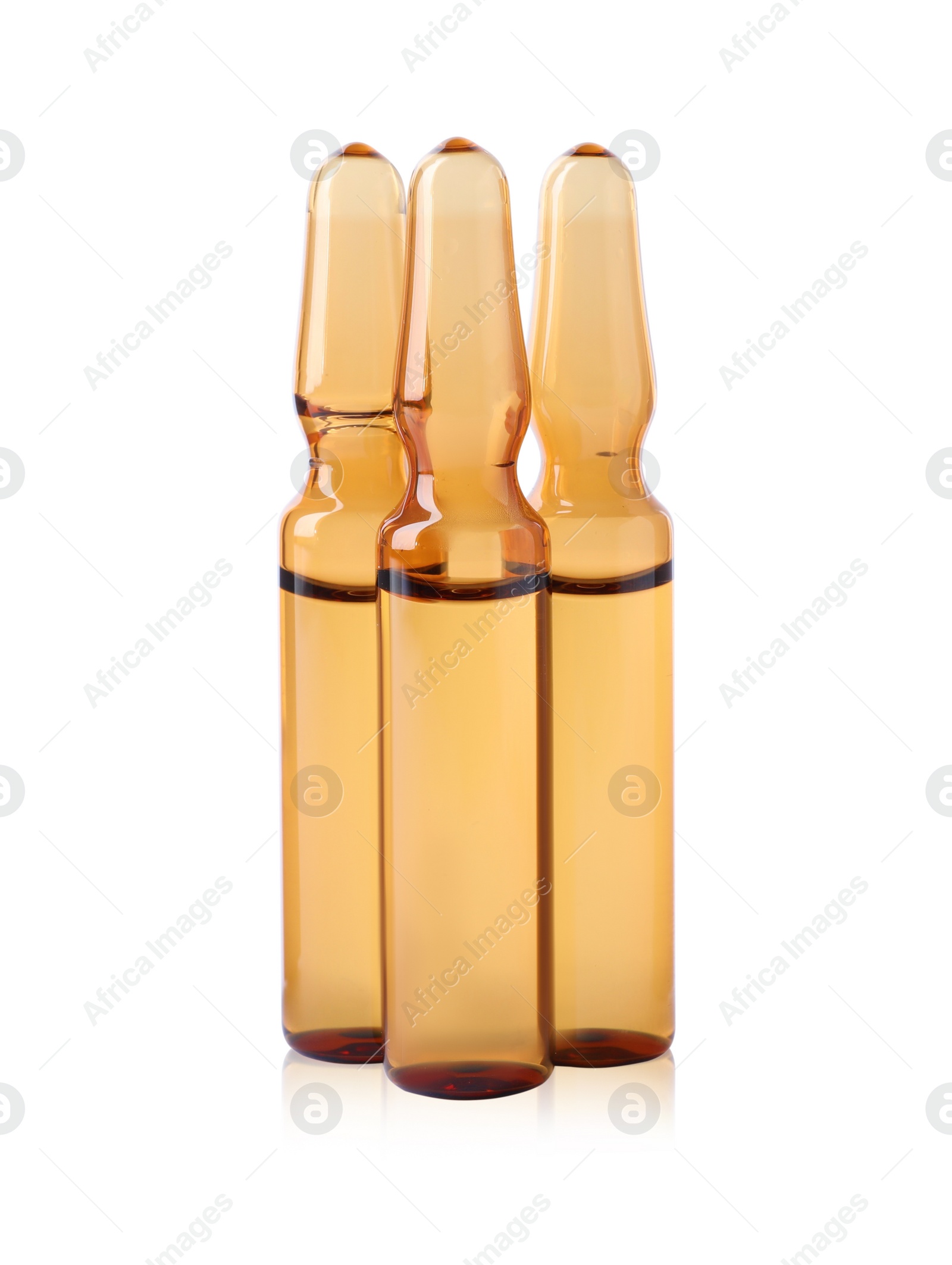 Photo of Brown pharmaceutical ampoules with medication on white background