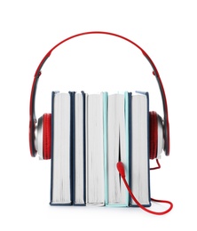 Modern headphones with hardcover books on white background