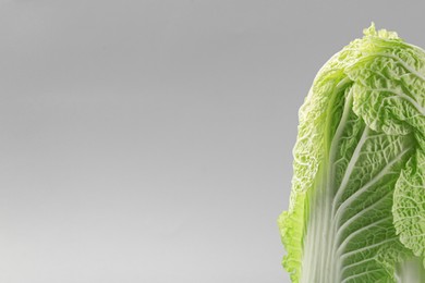 Fresh ripe Chinese cabbage on light grey background. Space for text