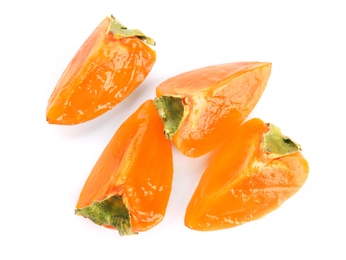Photo of Slices of delicious persimmon isolated on white, top view