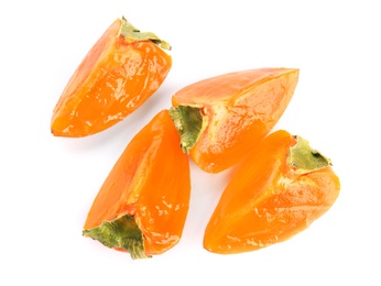 Slices of delicious persimmon isolated on white, top view