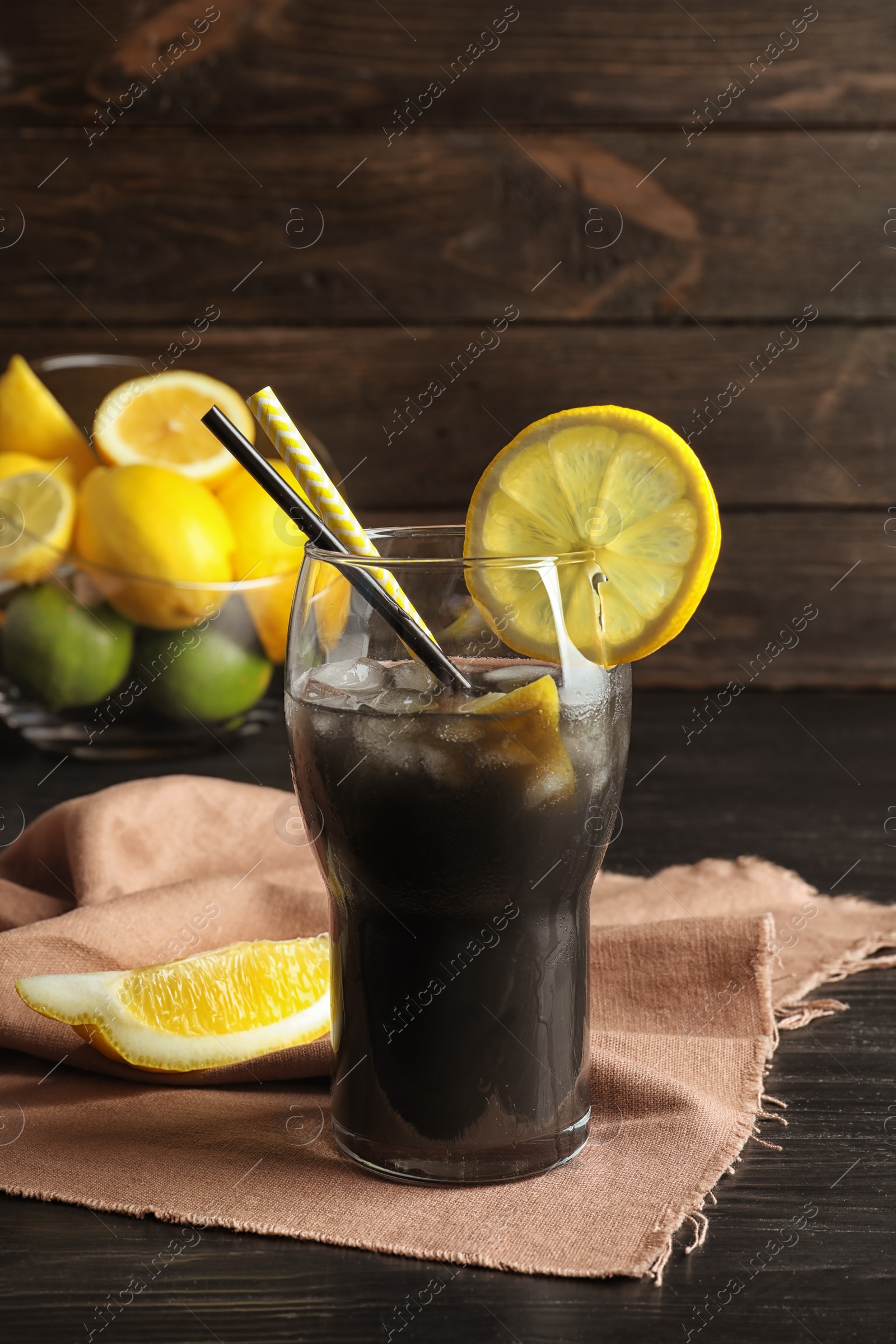 Photo of Glass with natural black lemonade on table