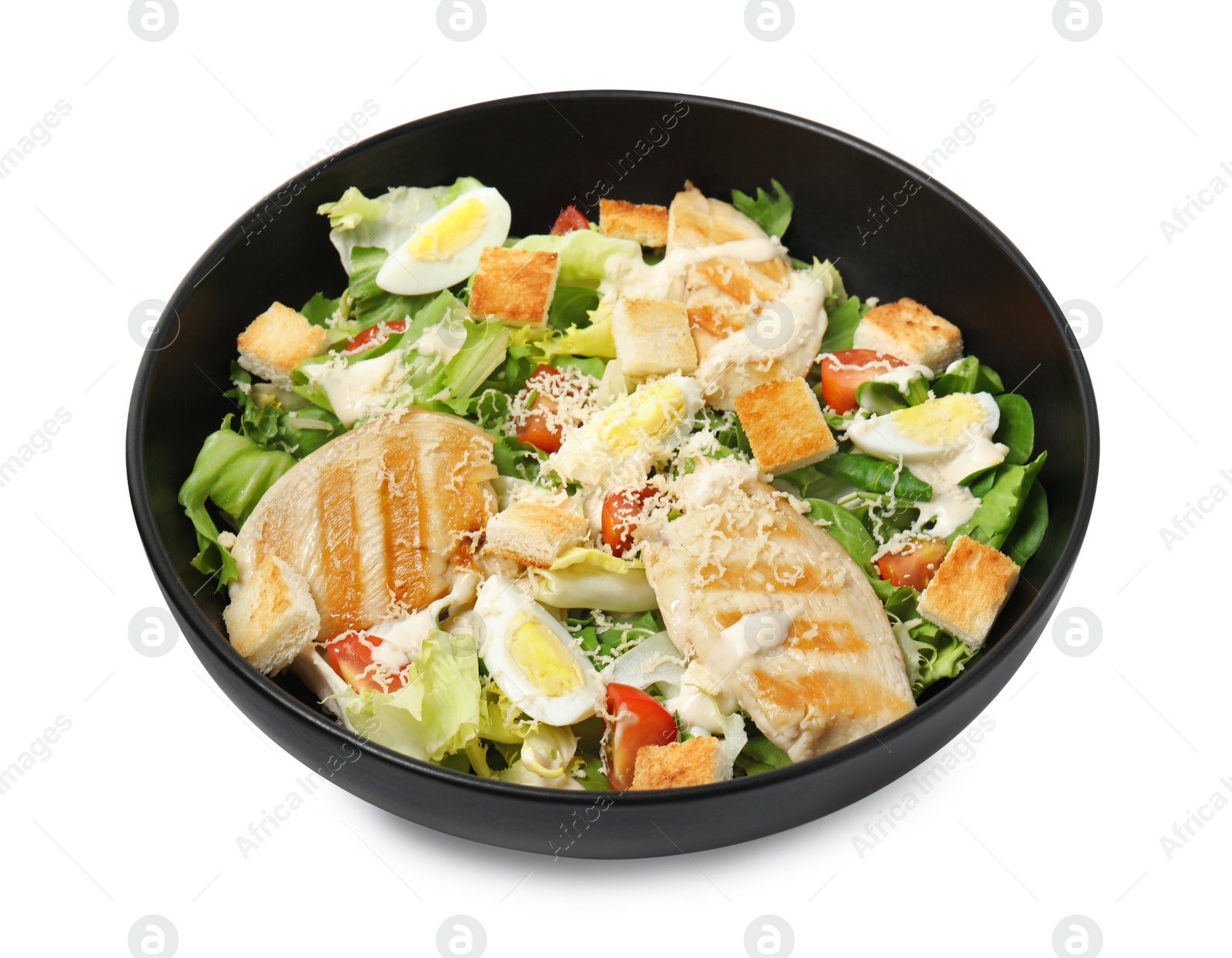 Photo of Delicious Caesar salad in bowl isolated on white