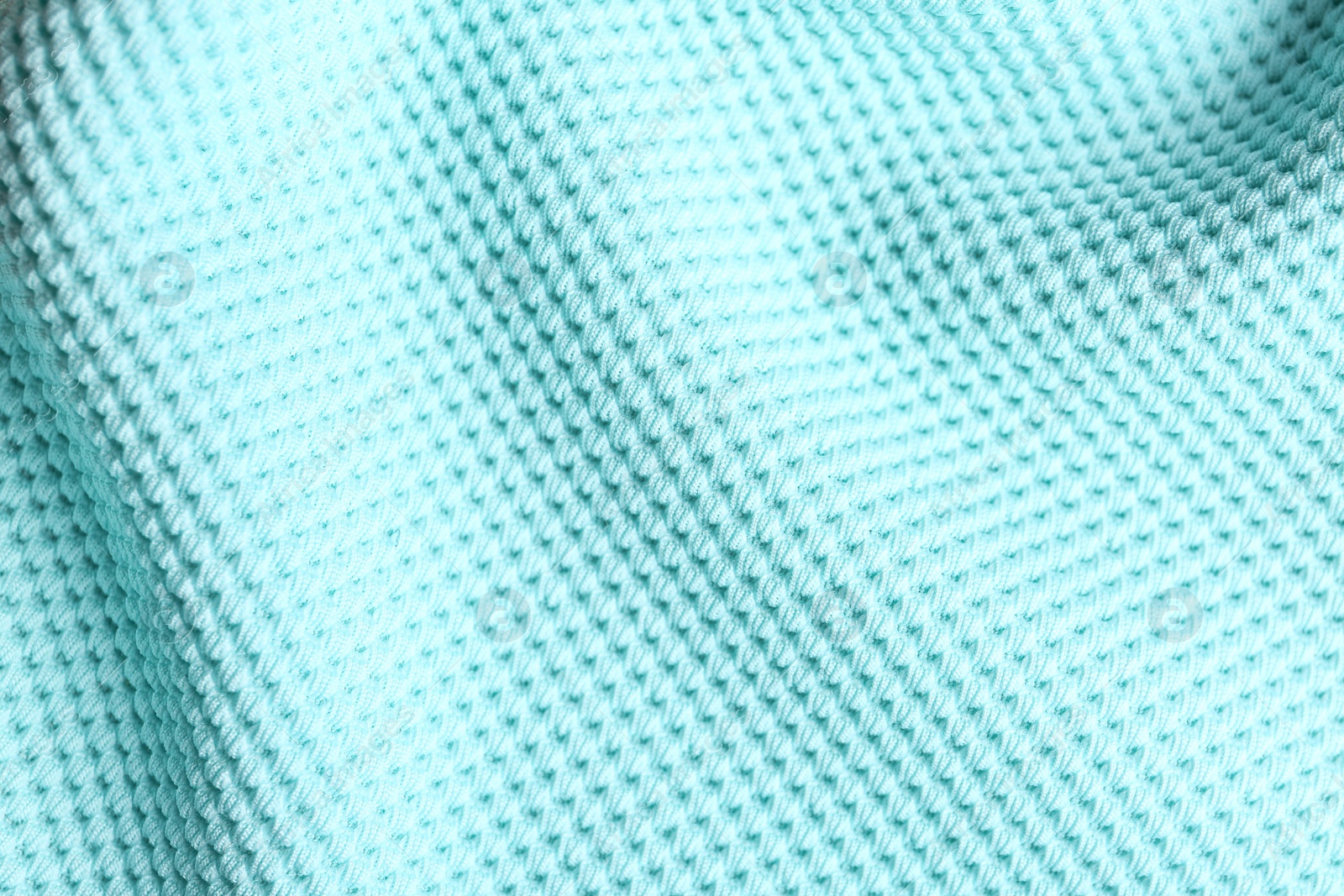 Photo of Textured light blue fabric as background, closeup