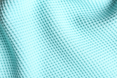 Photo of Textured light blue fabric as background, closeup