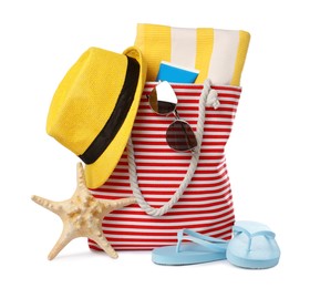 Photo of Stylish bag with beach accessories isolated on white