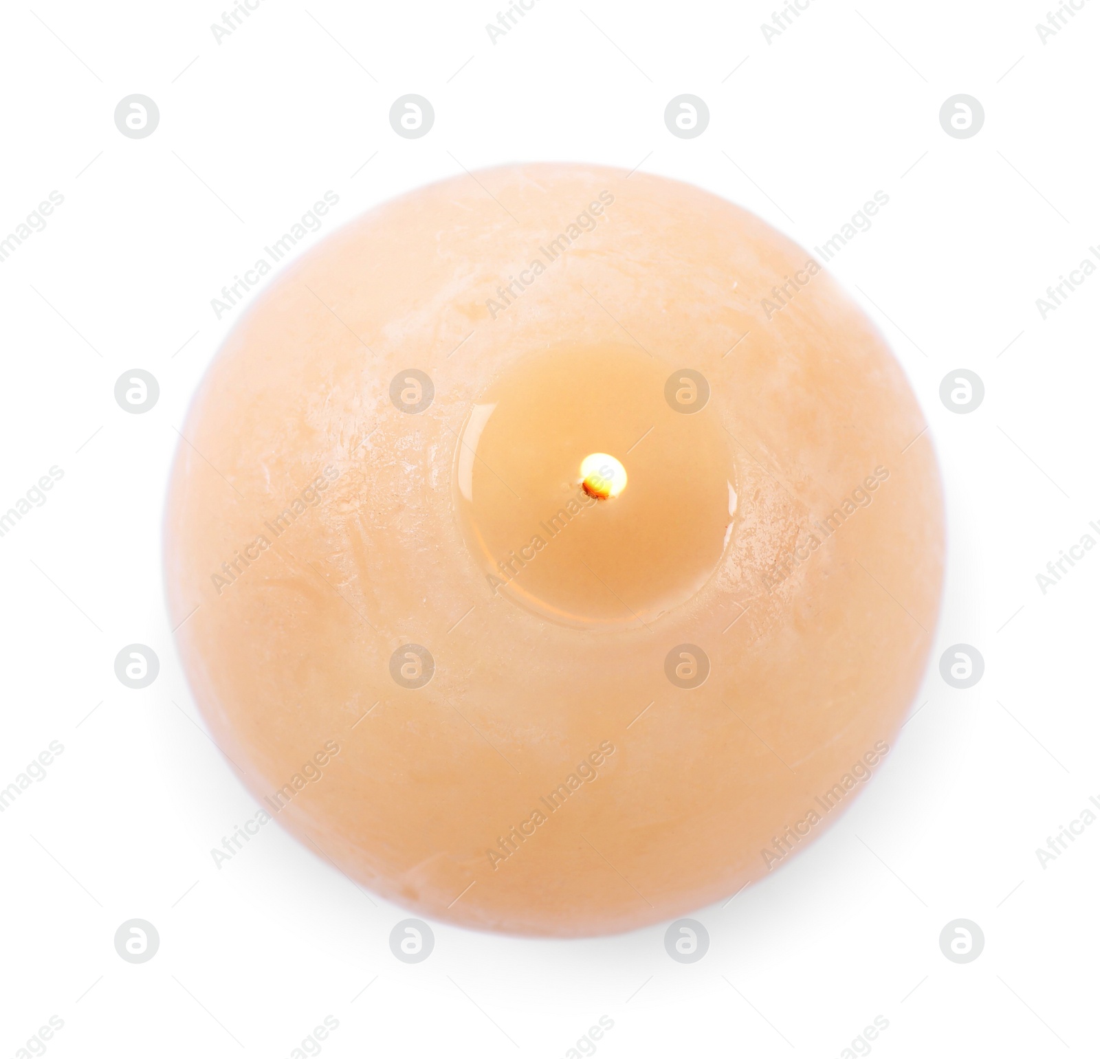 Photo of Burning beige wax candle isolated on white, top view