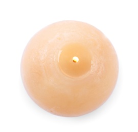 Photo of Burning beige wax candle isolated on white, top view