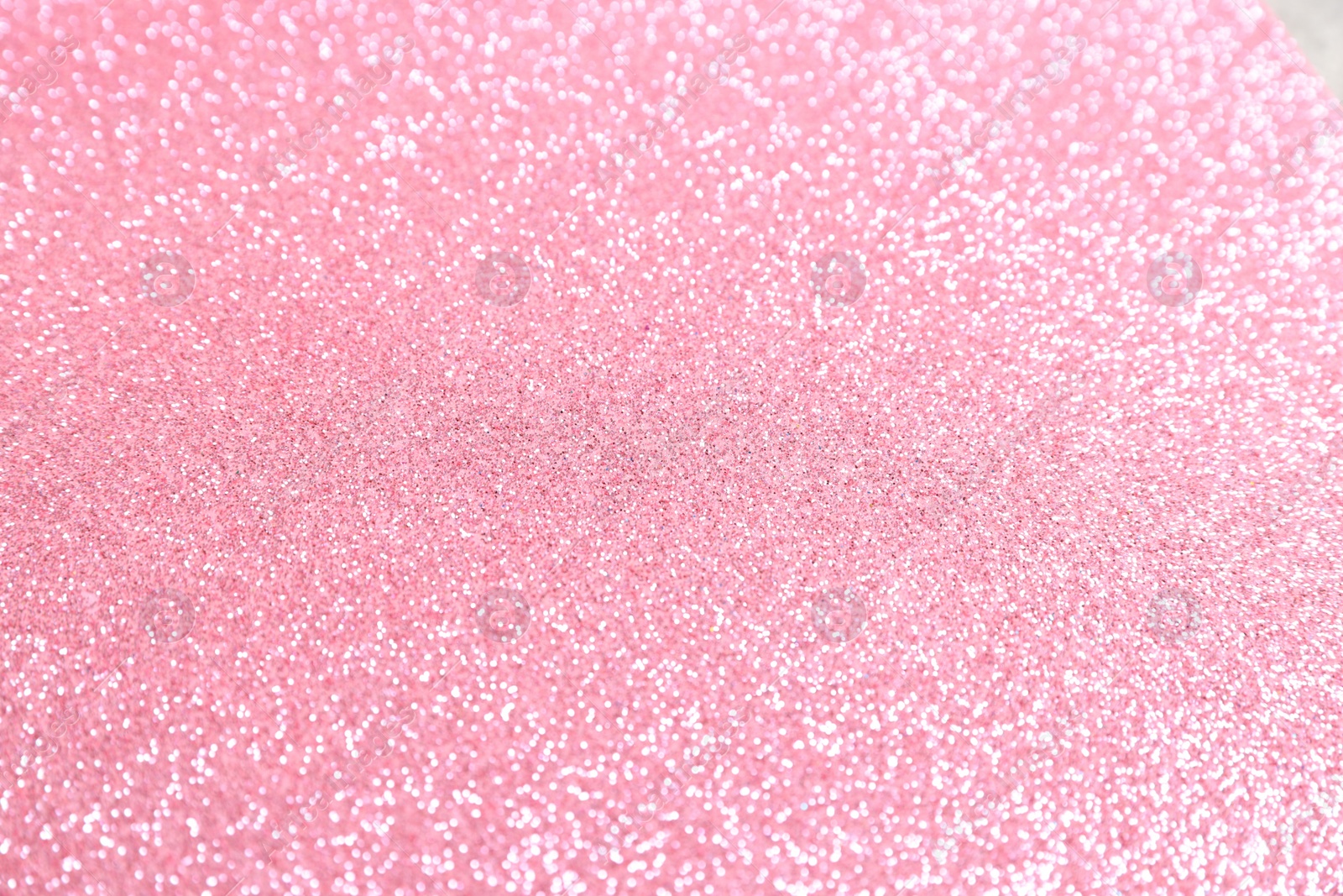 Photo of Beautiful pink shiny glitter as background, top view