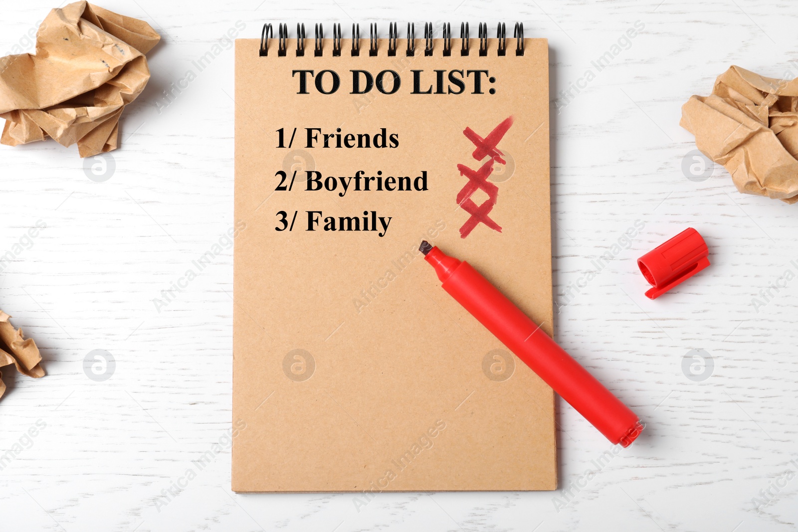 Photo of Flat lay composition with to do list and felt pen on wooden table. Solitude concept