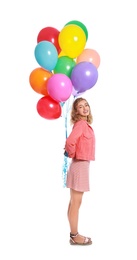 Young woman holding bunch of colorful balloons on white background