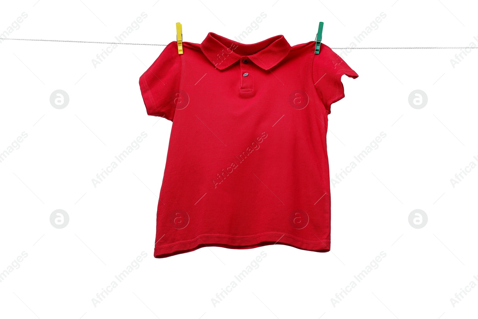 Photo of One red t-shirt drying on washing line isolated on white