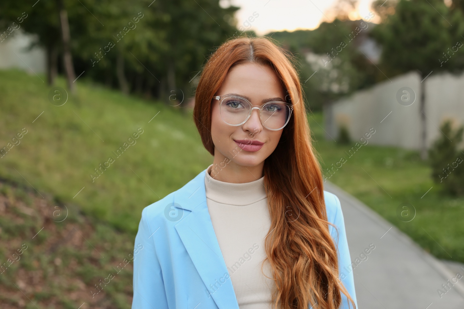 Photo of Portrait of beautiful woman in glasses outdoors