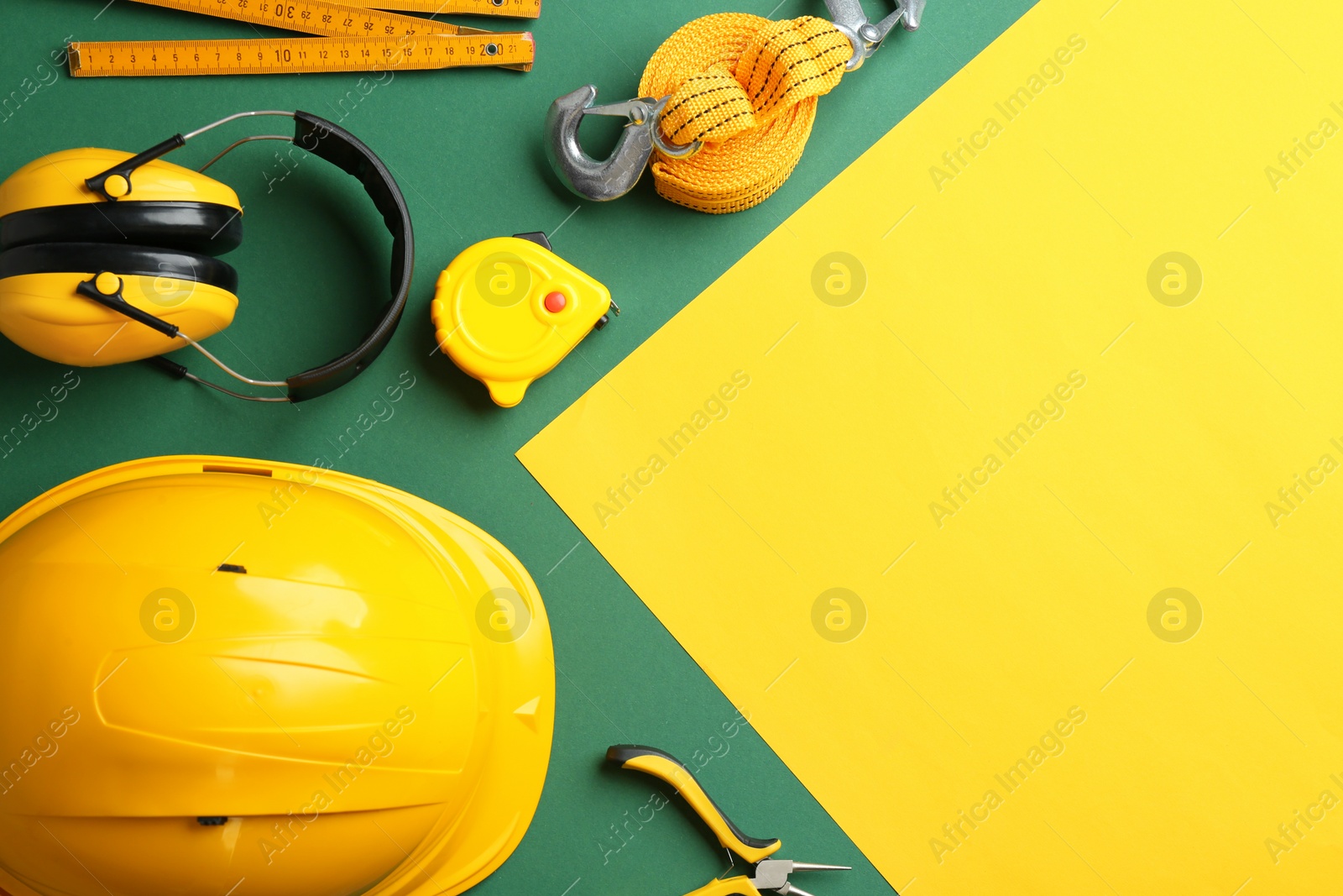 Photo of Flat lay composition with construction tools on color background, space for text