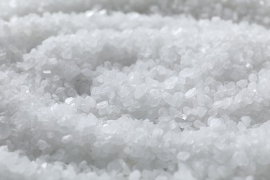 Photo of White natural salt as background, closeup view