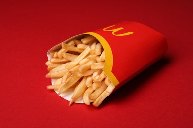 MYKOLAIV, UKRAINE - AUGUST 12, 2021: Big portion of McDonald's French fries on red background