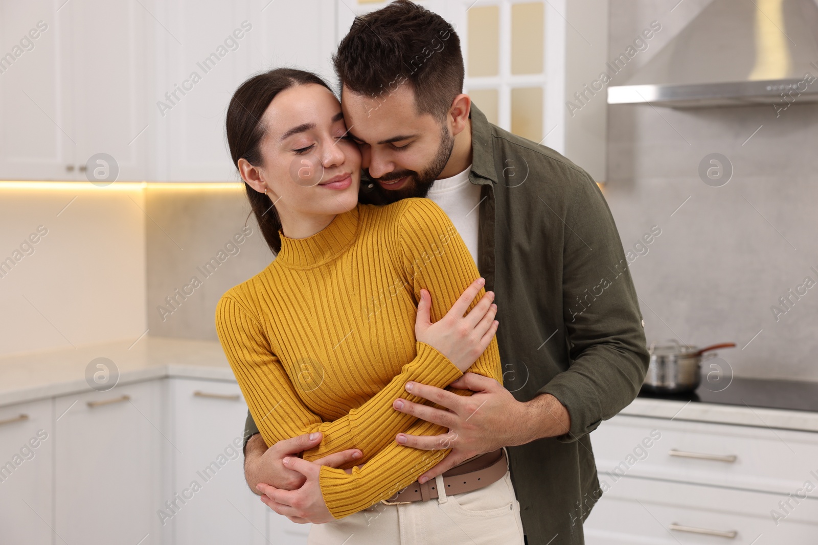 Photo of Lovely couple enjoying time together in kitchen