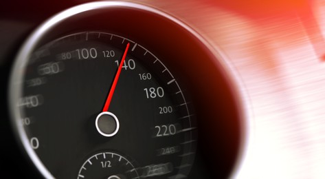 Image of Speedometer on car dashboard, closeup. Motion blur effect. Banner design